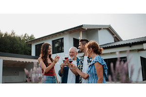 Family toasting with wine during, a Person Photo by HalfPoint