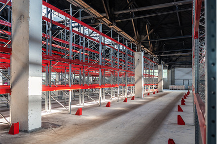 Warehouse with empty high pallet, an Industrial Photo by Jan Jack Russo Media