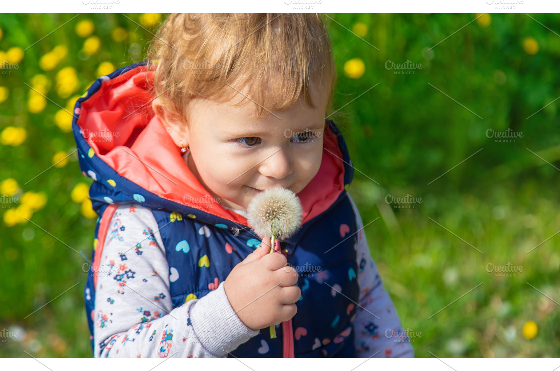 Child with dandelions in the garden, a Nature Photo by yanadjana