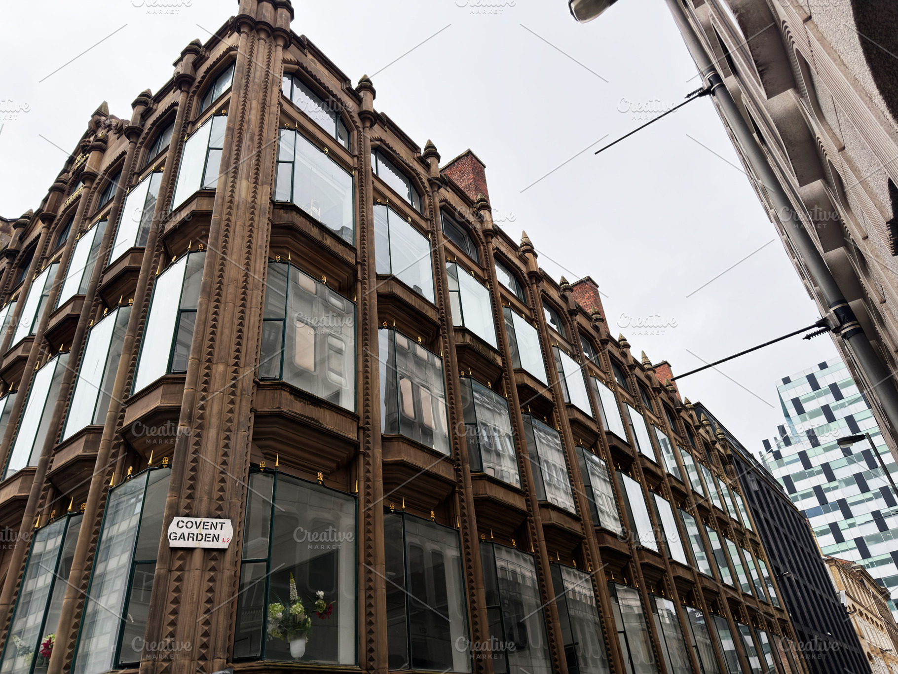 Perspective view of a historic brownstone building with large gl, a Photo by AS photostudio