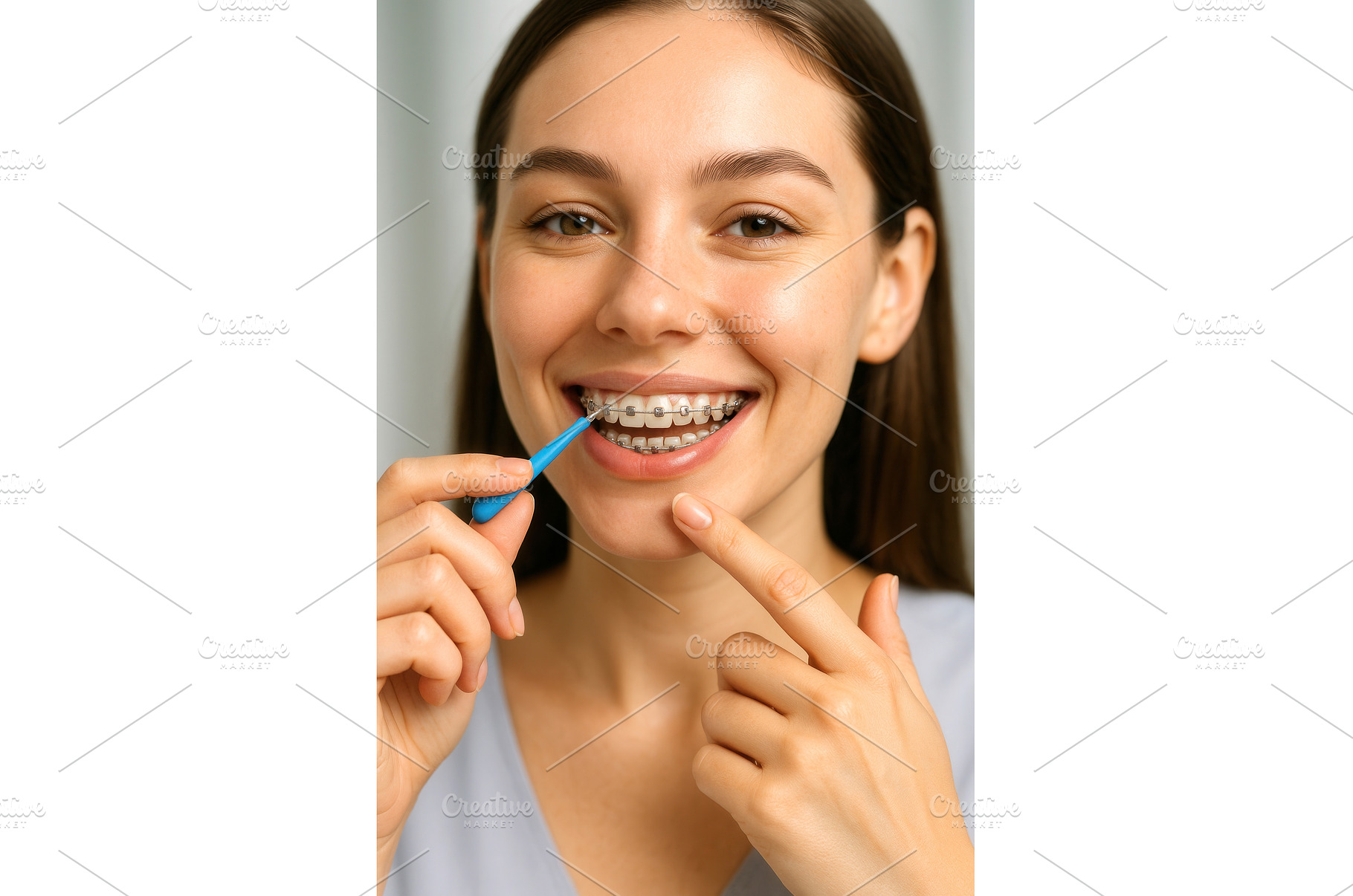 Smiling woman with braces using an, a Person Photo by Sergey Kotenev