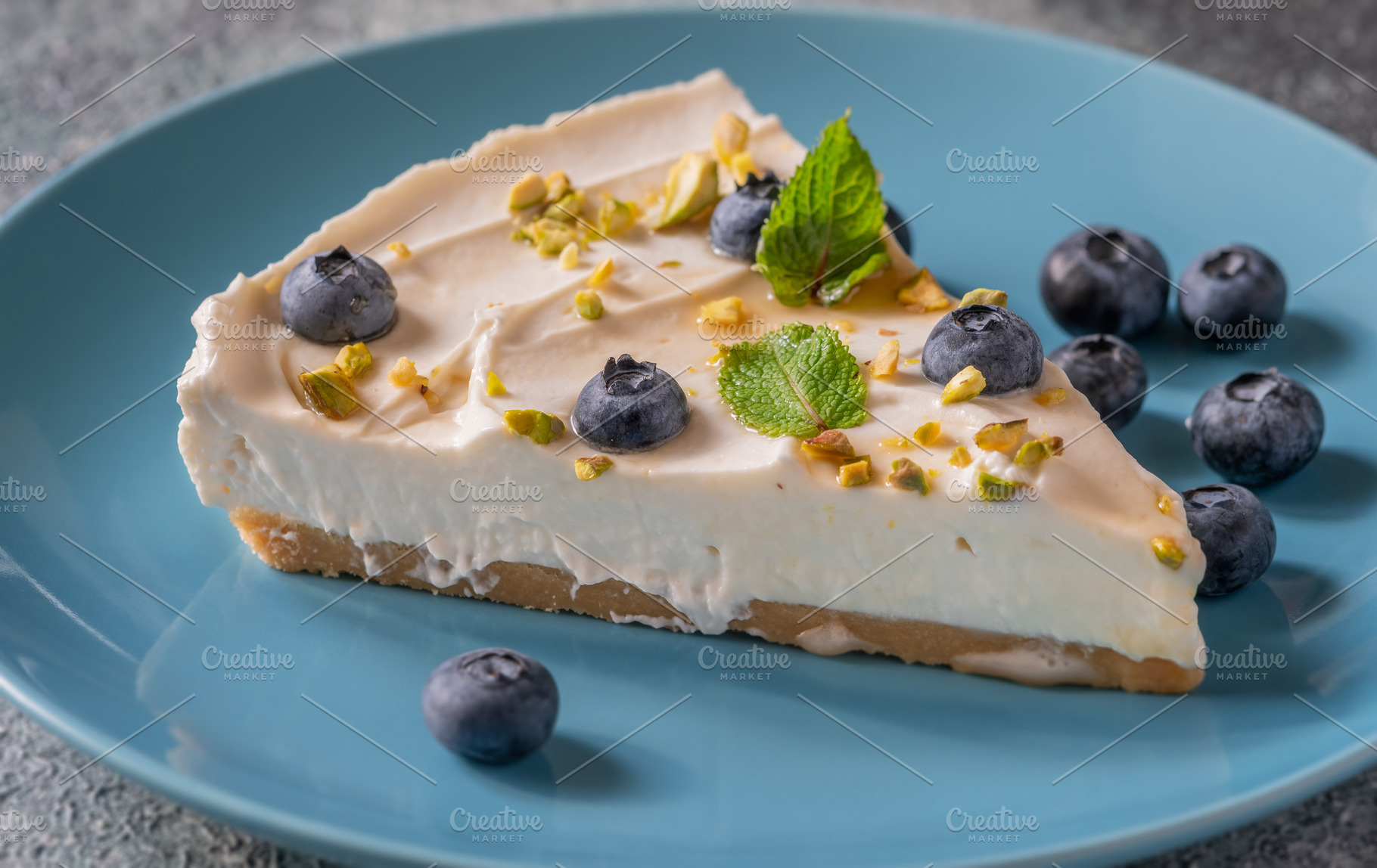 Creamy Mascarpone Cheesecake Slice Served With Blueberries Pista, a Food & Drink Photo by Alexander Prokopenko