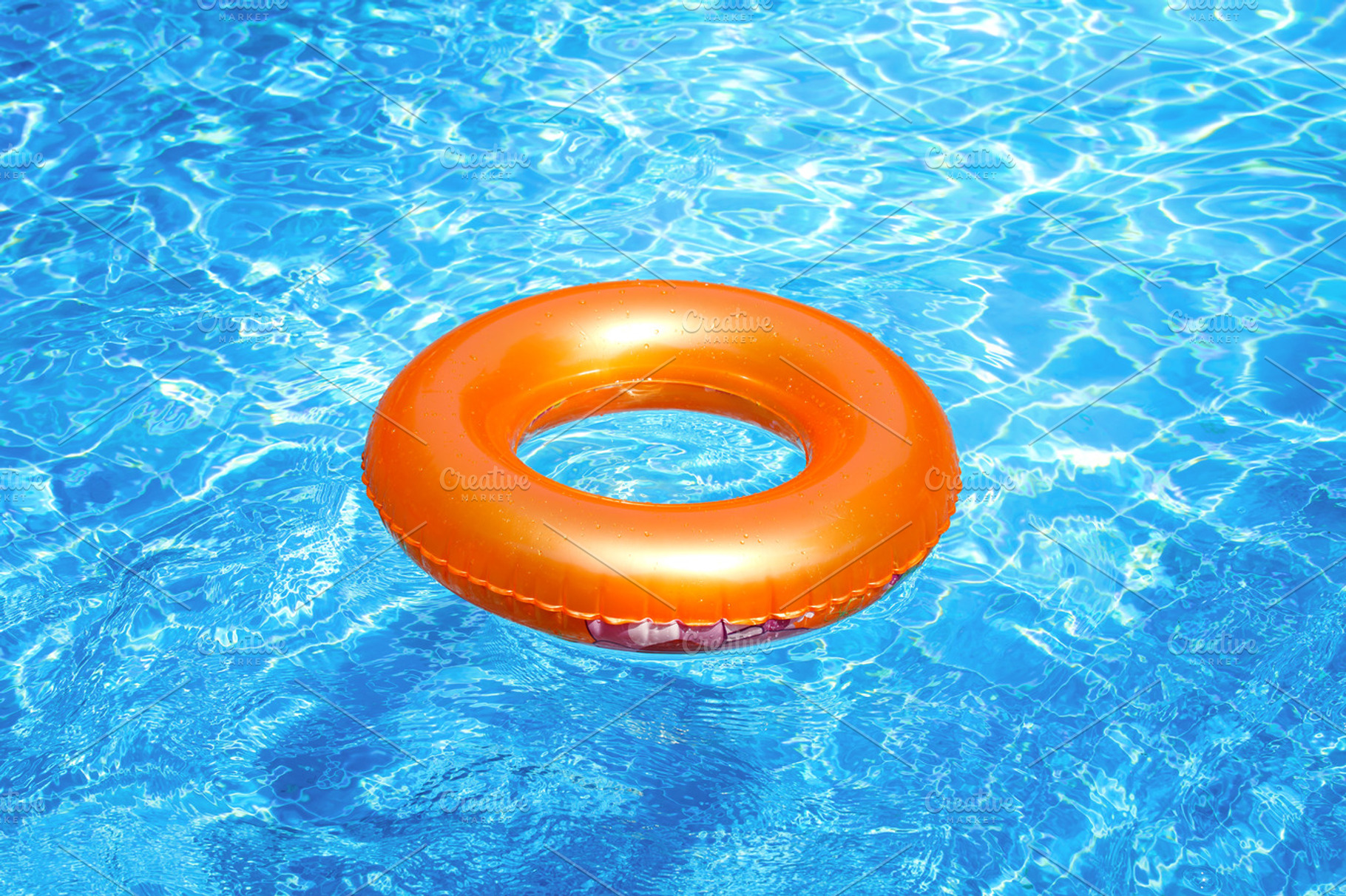 Orange pool float featuring beach, pool, and safe, a Sports ...