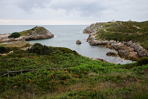 Rocky coast with green cliffs and a, a Nature Photo by Perpis