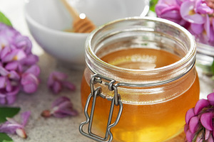 Organic honey jar with fresh blooming acacia flowers, a Food & Drink Photo by Olena Rudo