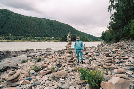 Man at the river Katun at summer day, a Person Photo by Jan Jack Russo Media