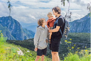 Father with his two sons standing in, a Nature Photo by Elizaveta Galitskaya