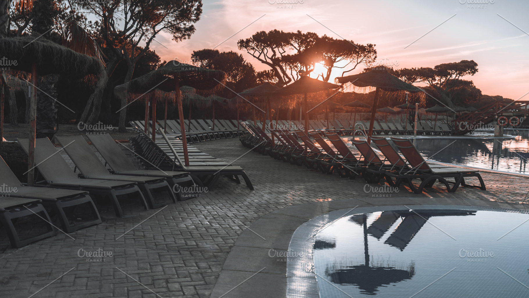 Sunset poolside with empty loungers, a Sports & Recreation Photo by SkyNext