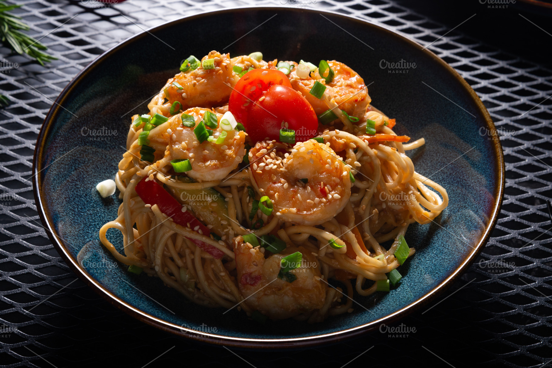 Noodles with Shrimp and Vegetables on Dark Plate on Black Table,, a Photo by MDBildes