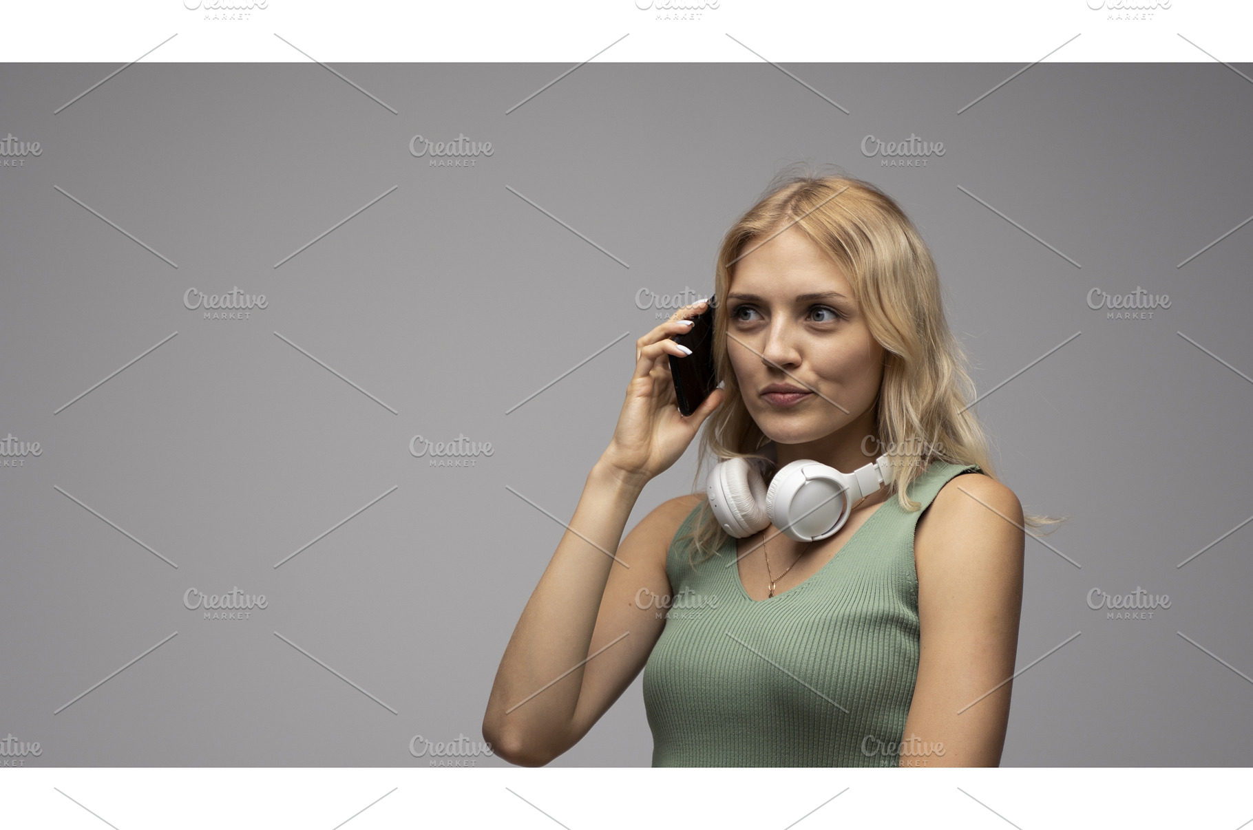Blonde young woman with headphones, a Person Photo by volodymyrshtun13795