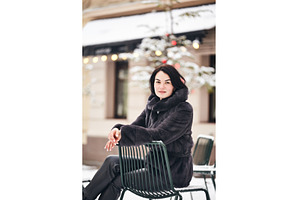 Portrait of a smiling woman sitting, a Person Photo by Rohan Photography