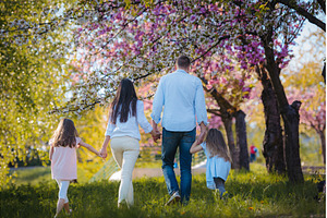 Rear view of family on walk in, a Person Photo by HalfPoint