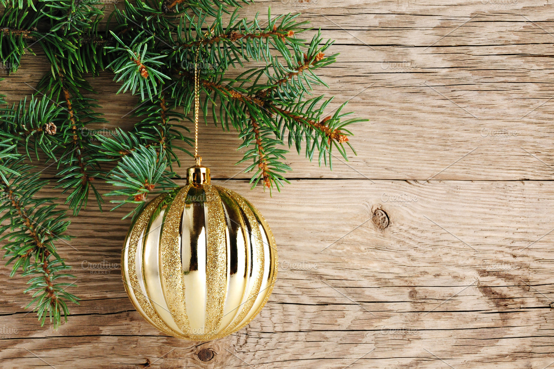Golden ball on christmas tree