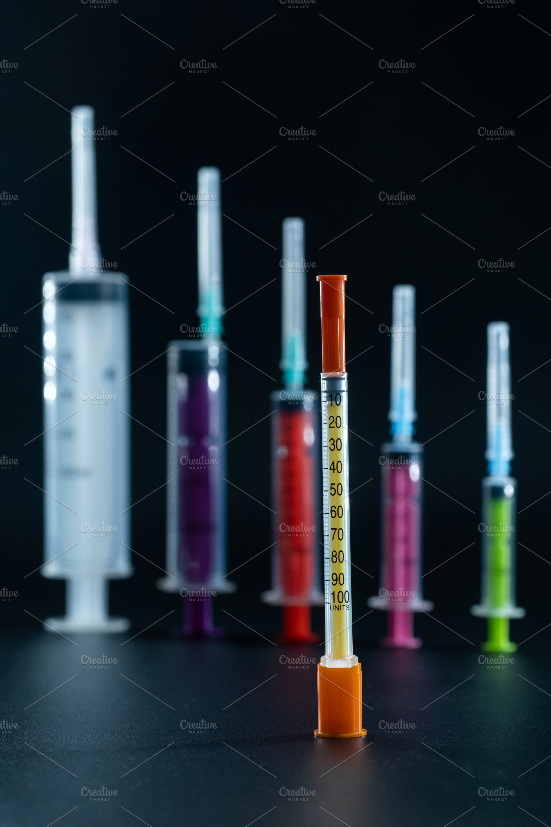 Thin insulin syringe contrasts with the bulkier syringes used for other medical, a Health & Medical Photo by Rohan Photography