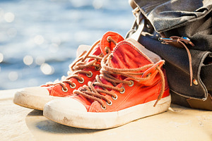 Red sneakers and backpack