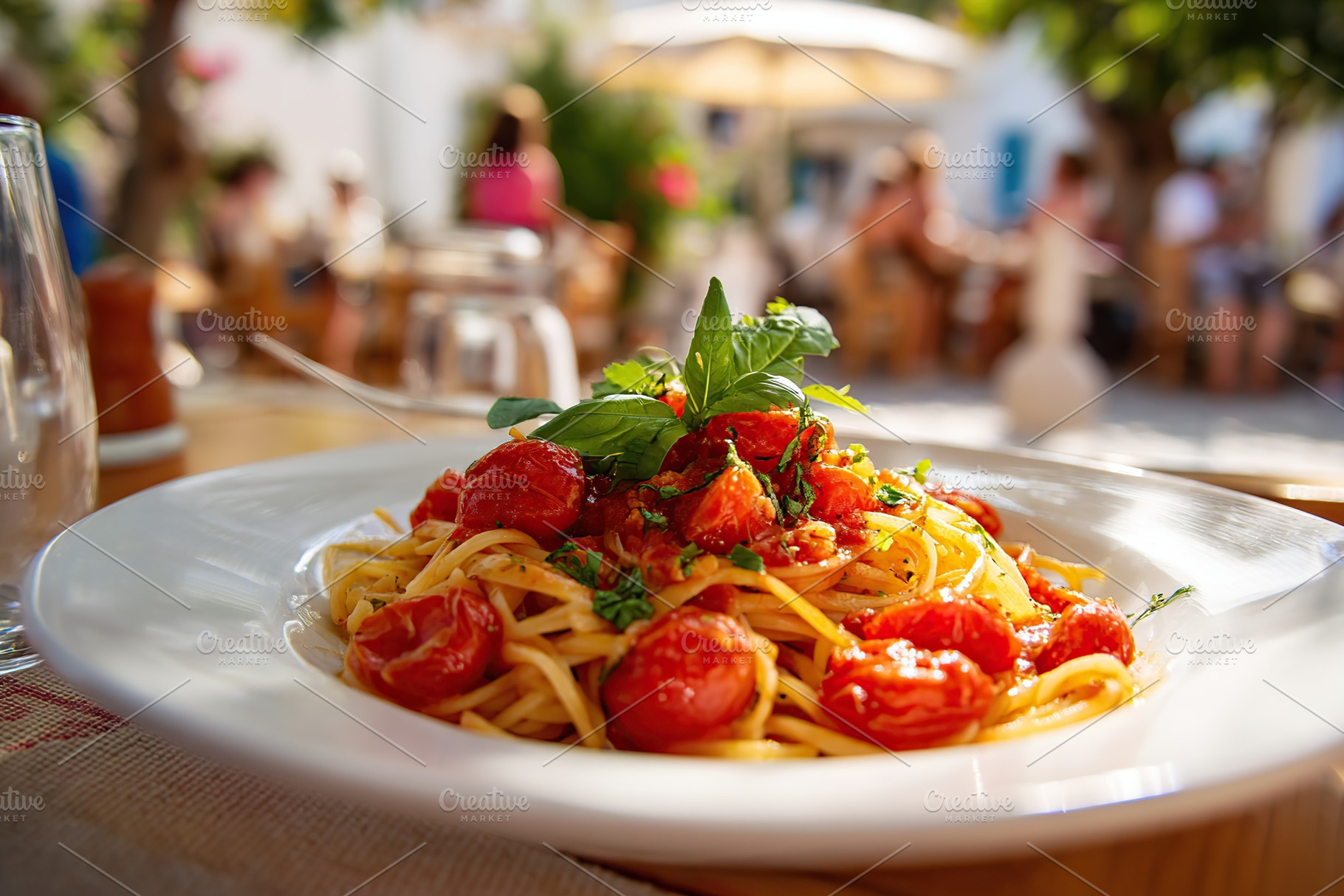 Delicious Italian pasta with fresh tomatoes and herbs served at an outdoor cafe, a Food & Drink Photo by AlyaAnd