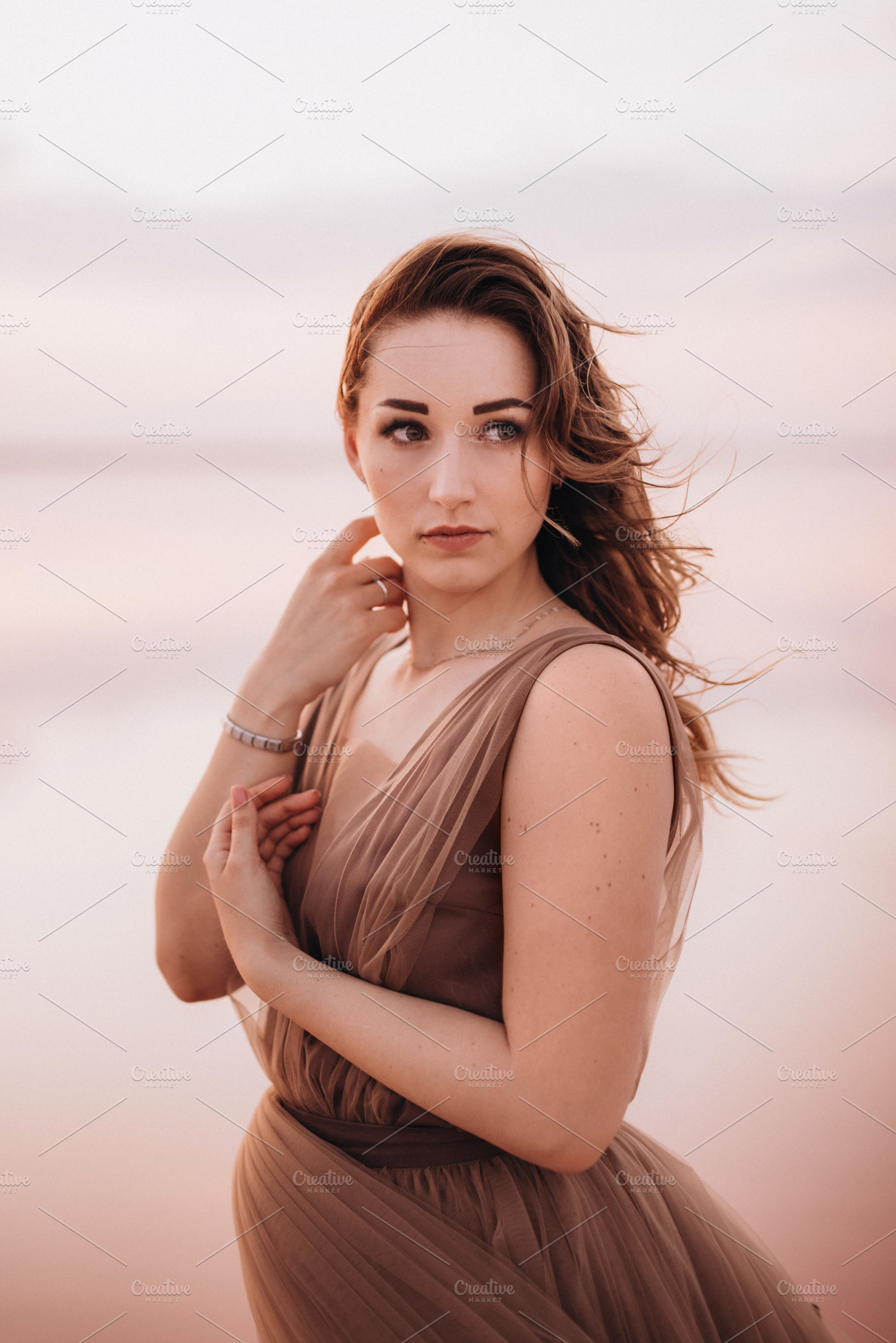 girl on the shore of a pink salt lake, a Person Photo by Weddings, People, Travel