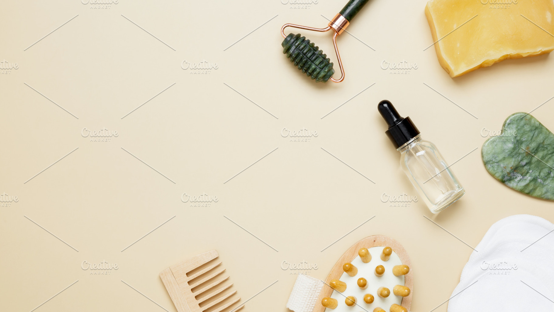 Beauty care arrangement featuring marble roller, gua sha, wooden body brush, fa, a Photo by matucha