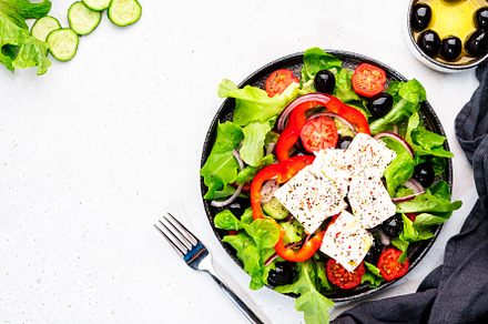 Greek salad with feta cheese, black olives, tomatoes, paprika, c, a Food & Drink Photo by 5PH