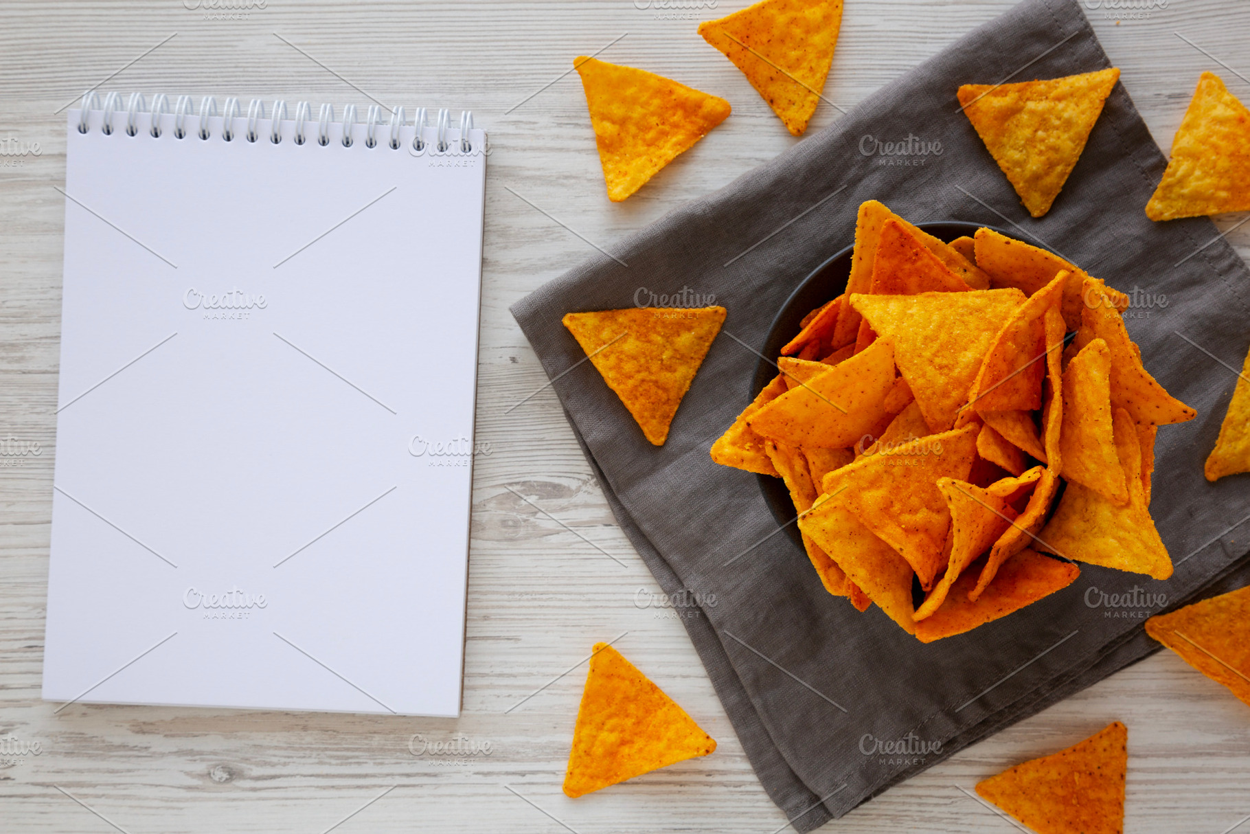 Crunchy Nacho BBQ Tortilla Chips in a Bowl, blank notebook, top, a Food & Drink Photo by LiudmylaChuhunova