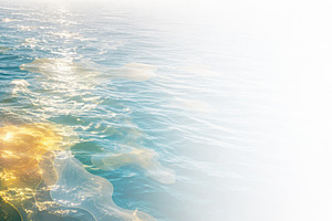 Ocean heatwave reflecting sunlight o, a Photo by Dvoevnore photos