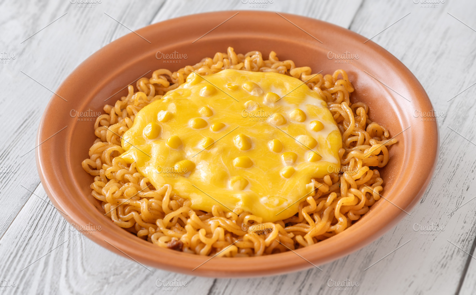 Cheesy Korean ramen with sweet corn and creamy melted cheese in, a Food & Drink Photo by Alexander Prokopenko