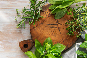 Fresh cooking herbs on wooden board preparing ingredients, a Food & Drink Photo by Olena Rudo