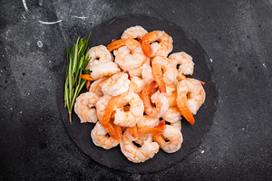 A plate of shrimp with a sprig of rosemary on top. The shrimp ar, a Food & Drink Photo by composter-box@mail.ru