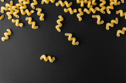 Raw pasta cavatappi with copy space