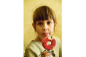 Portrait of a cute girl with a donut, a Food & Drink Photo by Rohan Photography