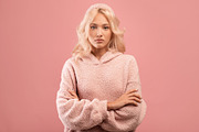Serious stylish lady looking at camera and posing with folded arms over pink st, a Photo by Prostock-Studio (Thumbnail 1 of 2)