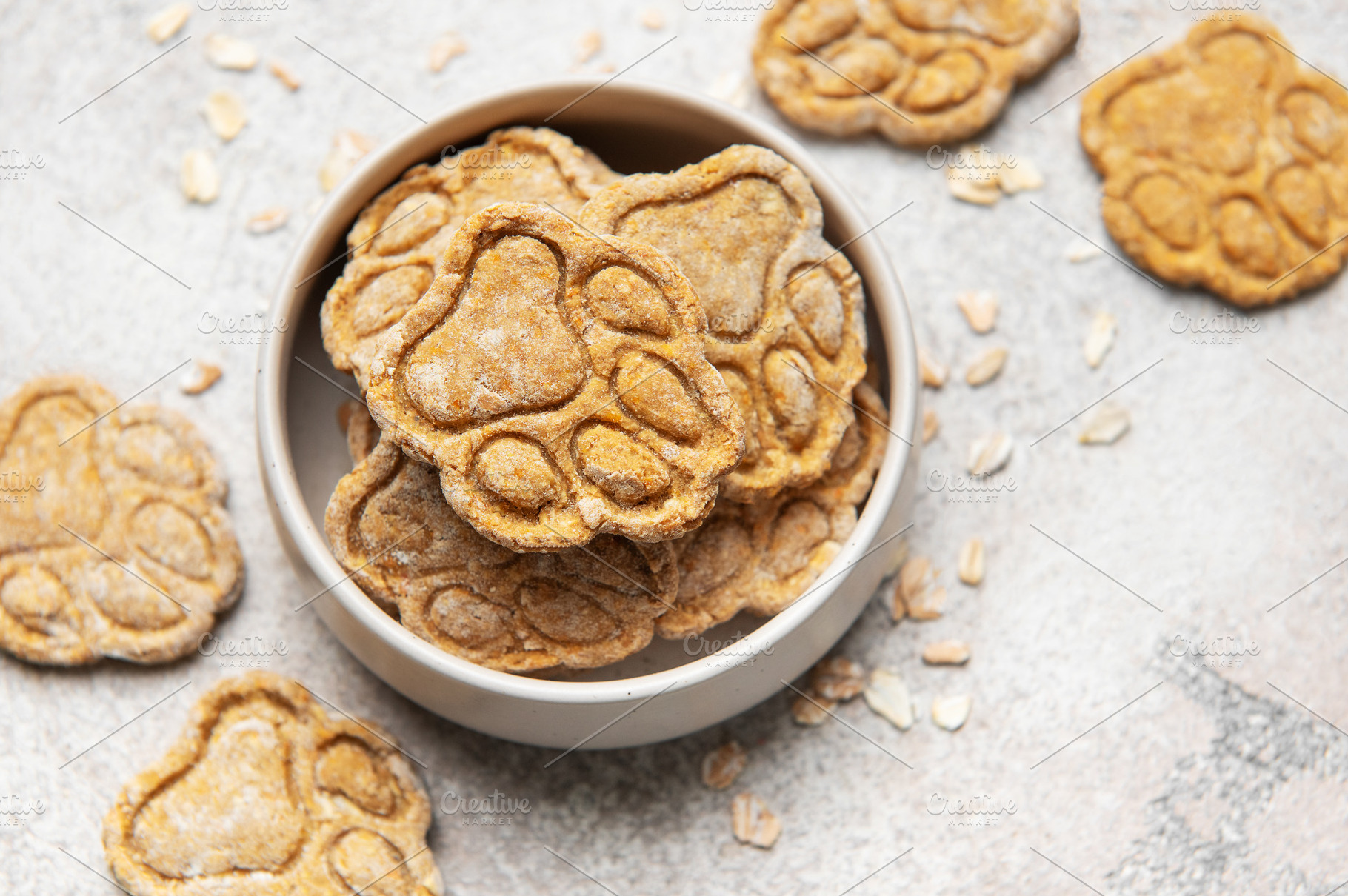 Homemade dog treats in bowl with paw prints, a Food & Drink Photo by Olena Rudo