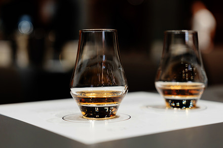 Whiskey tasting. Bright glasses with alcohol.
