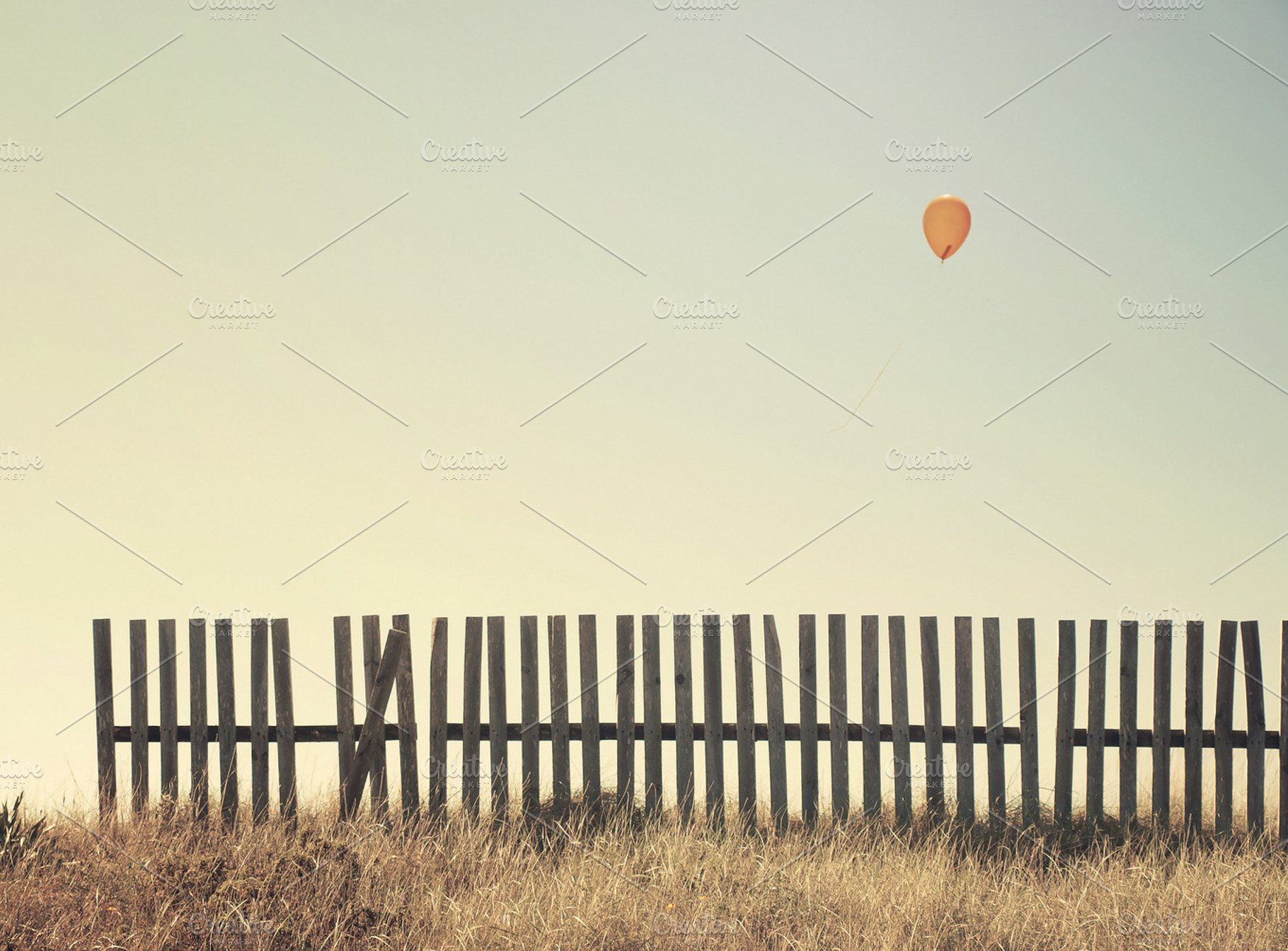 Solitude stock photo containing balloon and fence, a Nature Photo by Cazador de sueños