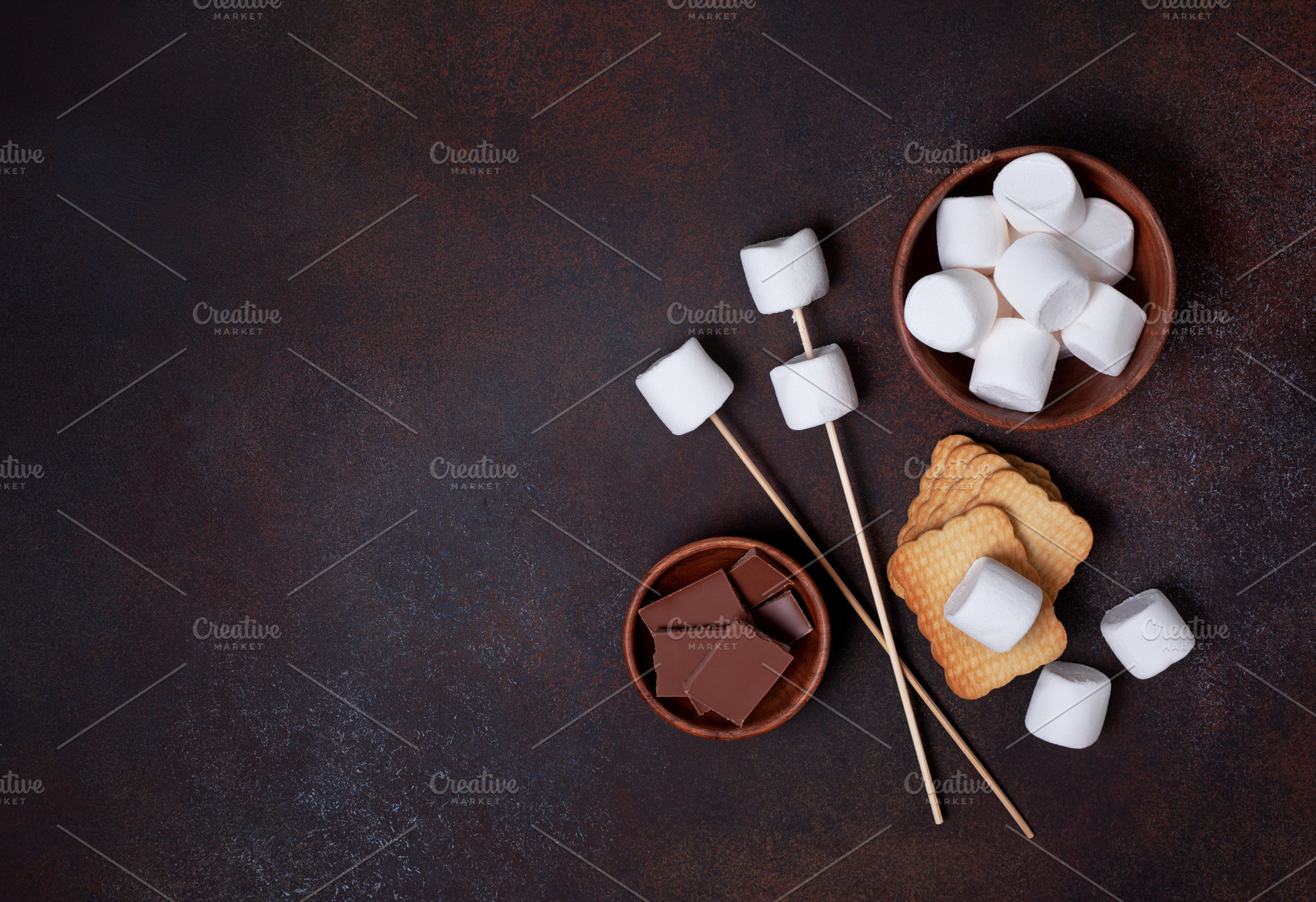 Ingredients for cooking smore containing campfire, marshmellows, and fire, a Food & Drink Photo by natashamam