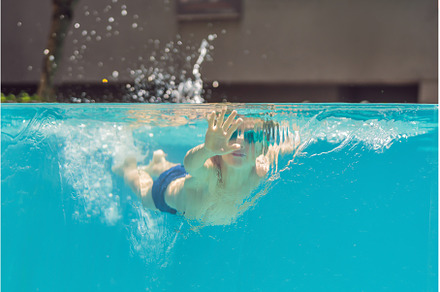 Boy having fun playing underwater in, a Person Photo by Elizaveta Galitskaya