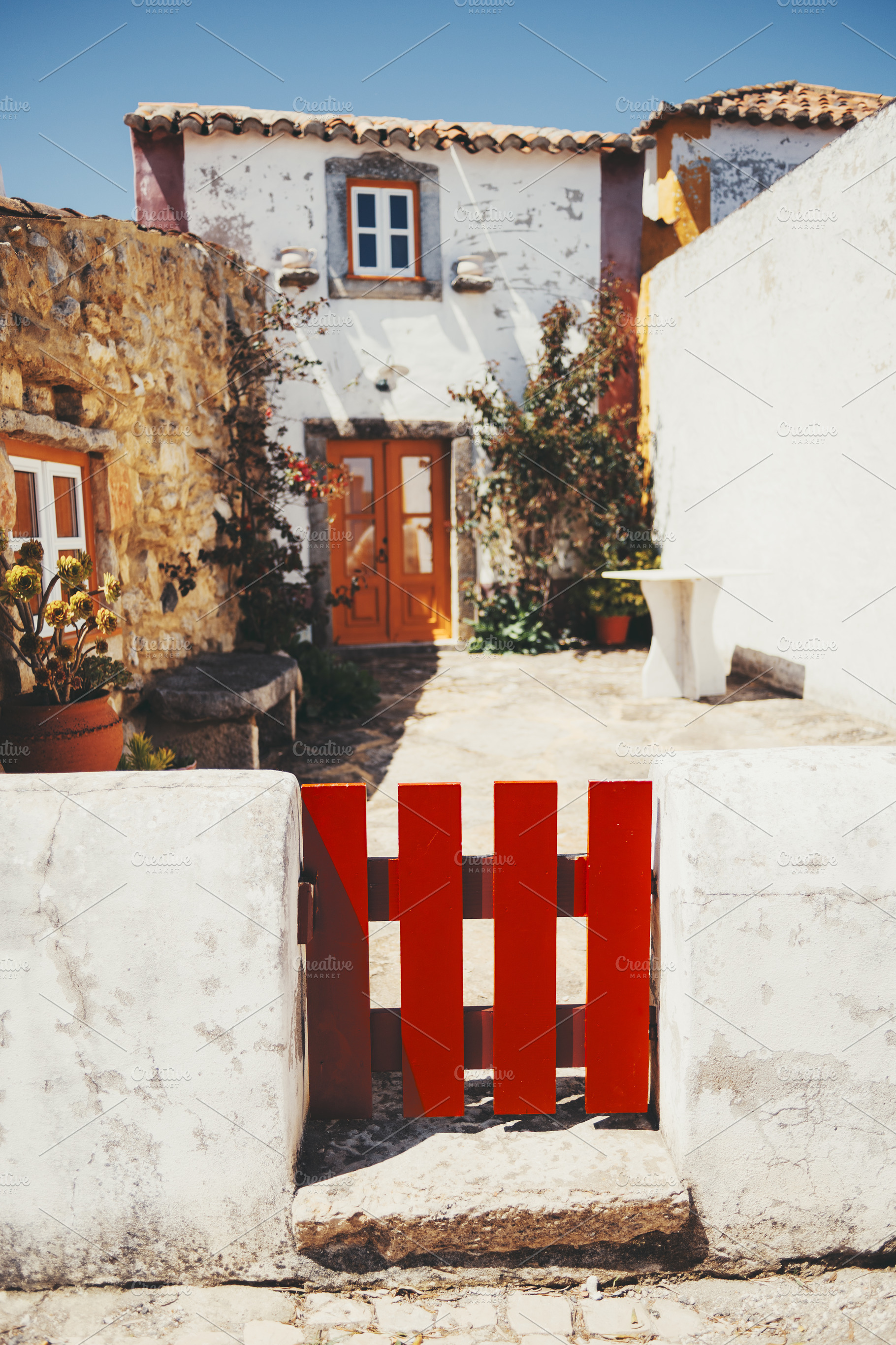Red gate and white stucco wall, an Architecture Photo by SkyNext