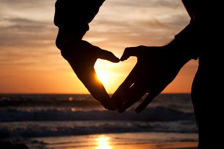 Hands forming a heart at the sunset containing sunset, heart, and love