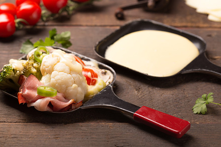 Healthy ingredients for raclette containing raclette, broccoli, and cheese