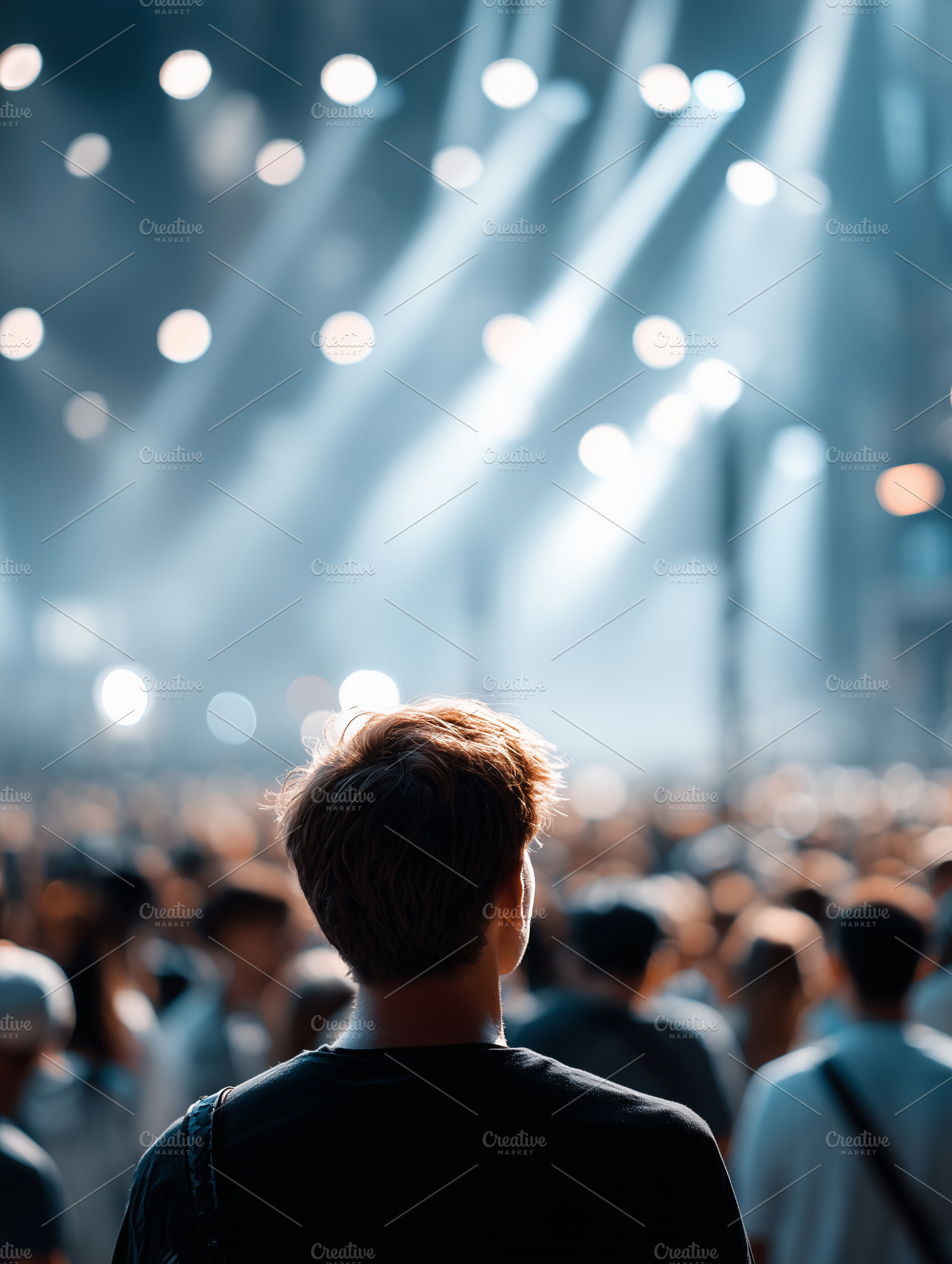 Back view of a young man standing in, an Arts & Entertainment Photo by MistyDay