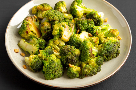 Homemade Pan-Fried Broccoli on a Plate on a black background, si, a Food & Drink Photo by LiudmylaChuhunova