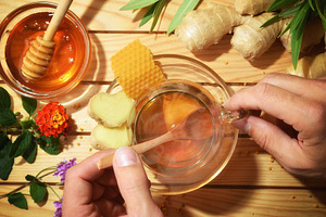 Person preparing a natural infusion of honey and ginger, a Food & Drink Photo by Davizro's Market