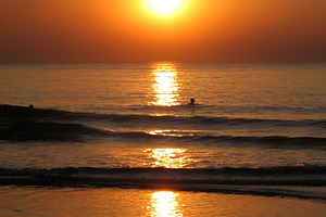 Swim at sunset, a Photo by saiko3p