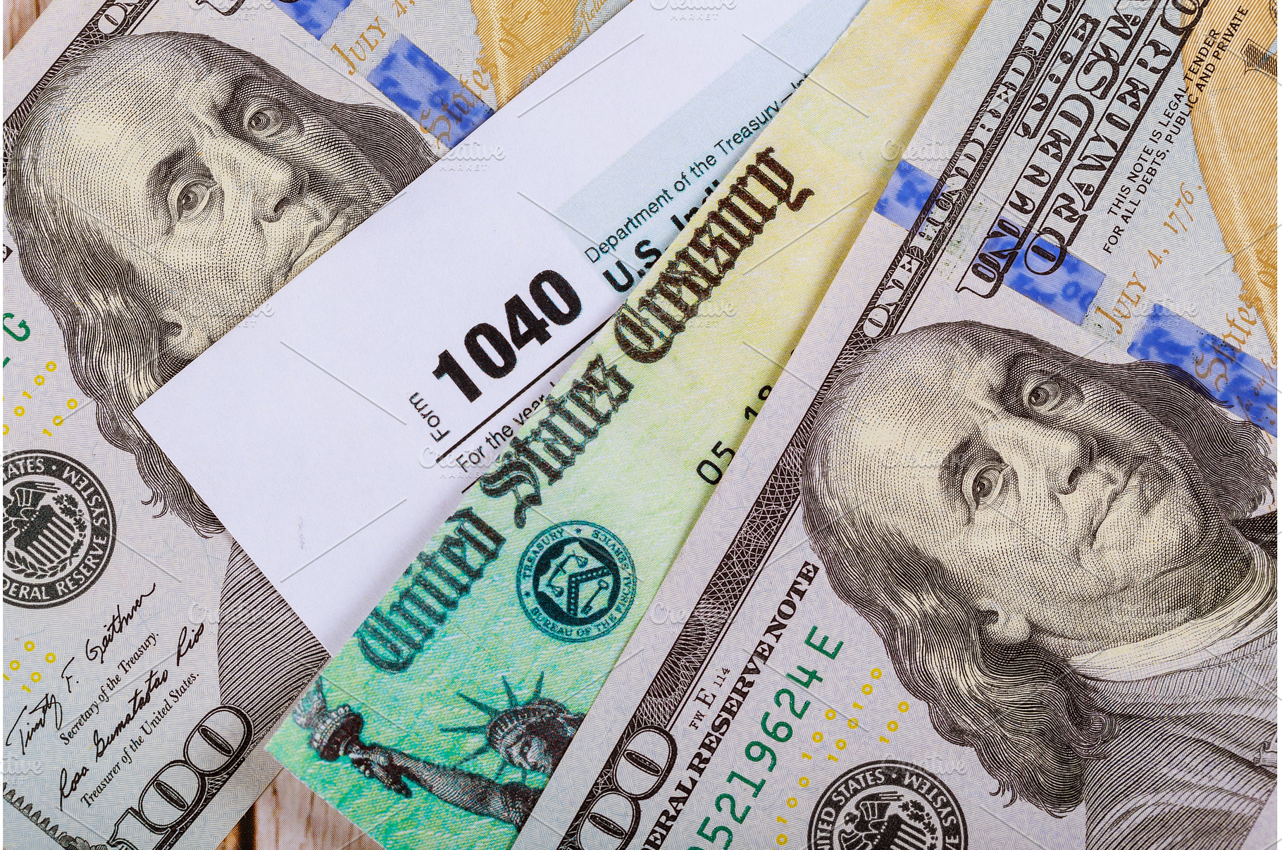 1040 Tax form with refund check and, a Business Photo by Ungvar Studio