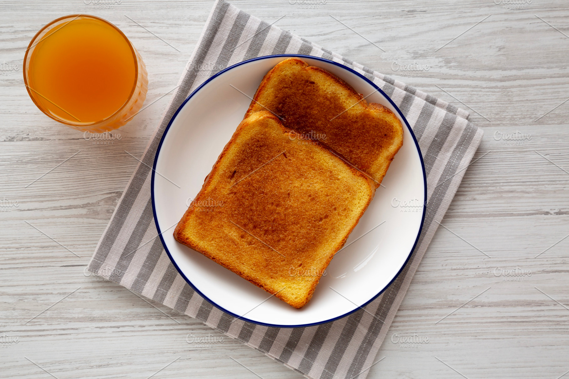 Homemade American Cinnamon Toast with Butter and Orange Juice, t, a Food & Drink Photo by LiudmylaChuhunova