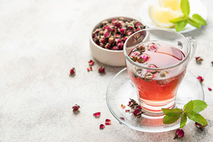 Pink rose herbal tea with dried buds and mint, a Food & Drink Photo by Olena Rudo