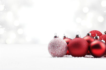 Red christmas baubles on snow with b, a Photo by Iftikhar Alam