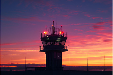 Airport control tower at sunset, a Transportation Photo by Ylivdesign