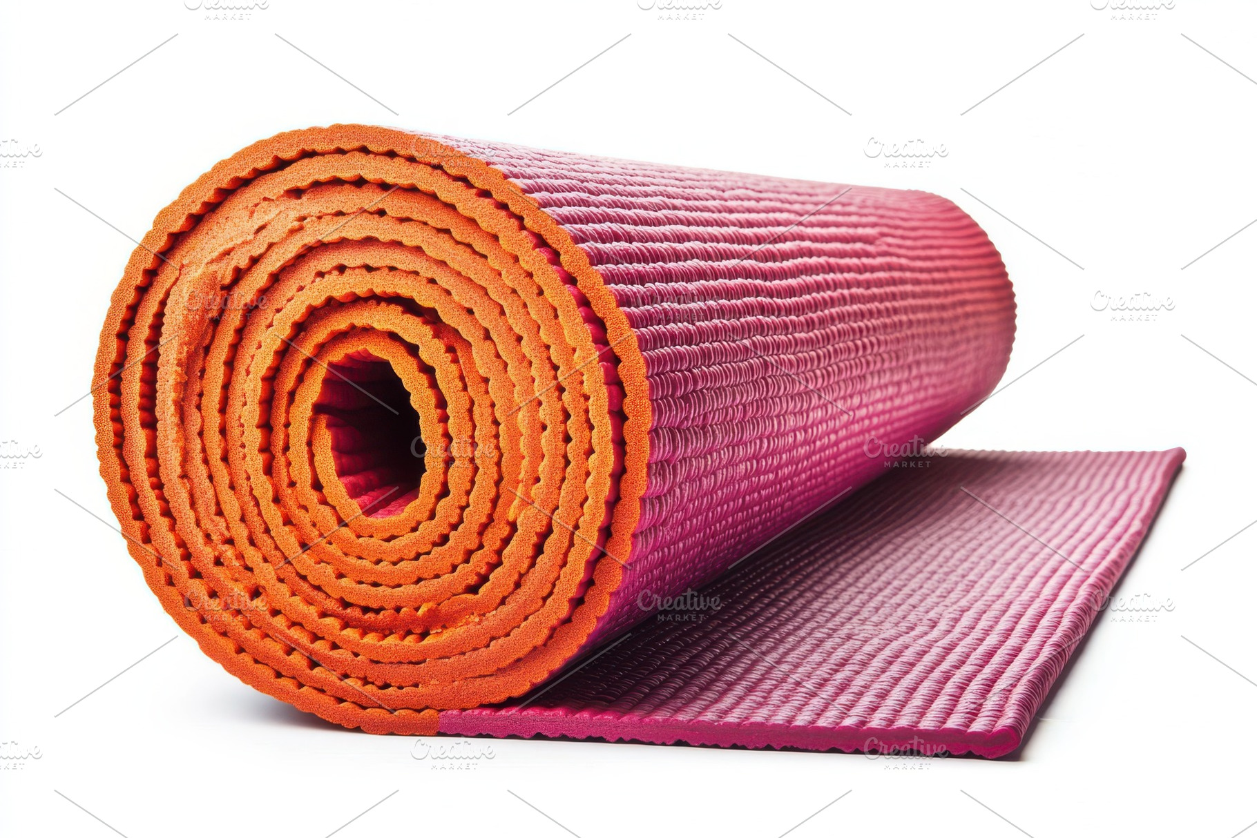 Rolled purple and orange yoga mat fi, a Photo by Pixeness Studio