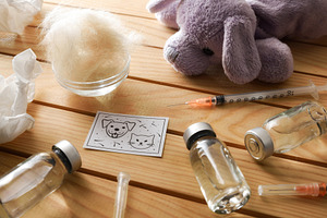 Childhood vaccination against pet dander and hair on wood table, a Health & Medical Photo by Davizro's Market
